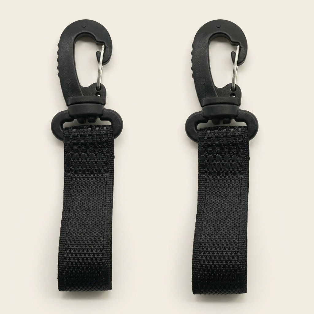 Two black carabiner straps on a light gray background